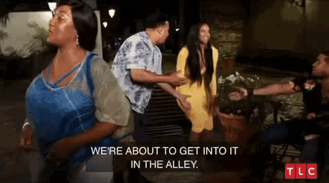 a group of people standing next to each other with a caption that says we 're about to get into it in the alley