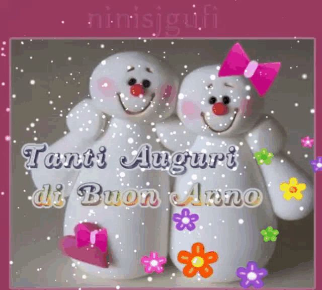 a couple of snowmen are sitting next to each other with the words tanti auguri di buon anno