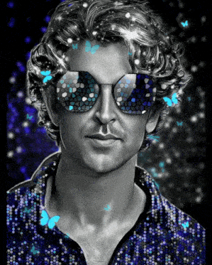 a black and white portrait of a man wearing sunglasses and a blue shirt