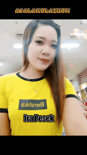 a woman wearing a yellow shirt that says ira pesek on it