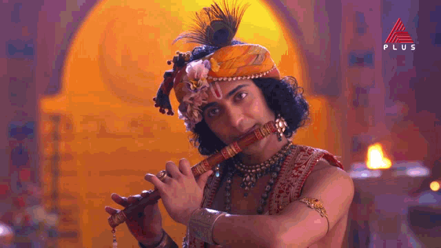 a man is playing a flute in front of a plus sign
