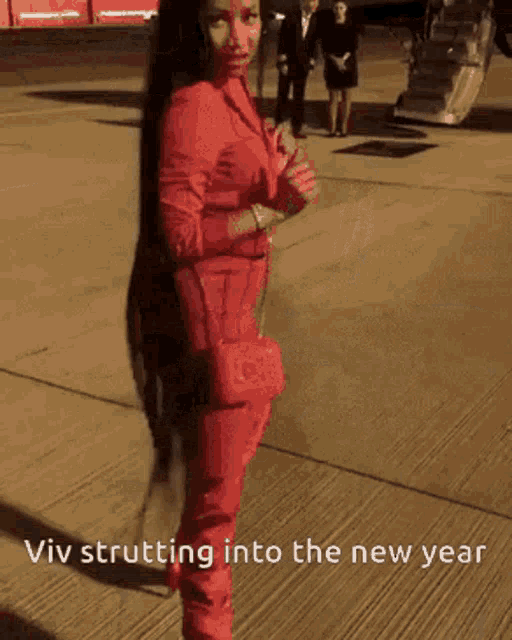 a picture of a woman walking with the words viv strutting into the new year on the bottom