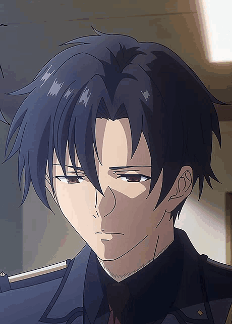 a close up of a person 's face with a serious look on their face