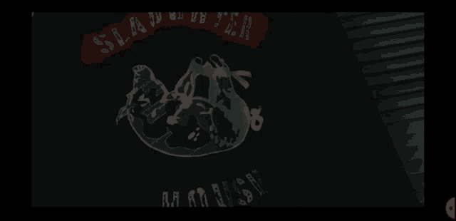 a black shirt that says ' slaughterhouse ' on it