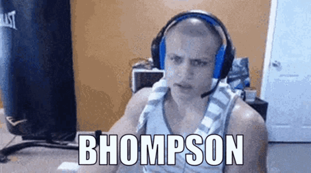 a bald man wearing headphones and a towel around his neck says bhompton