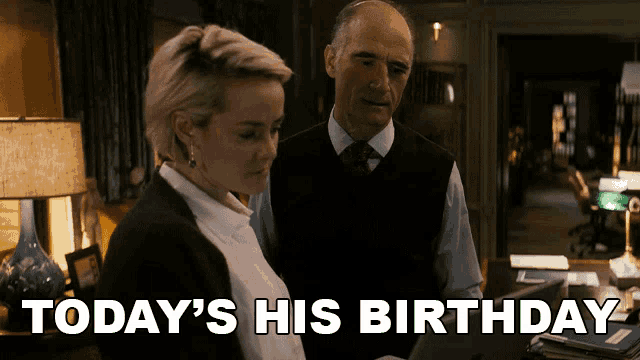 a man and a woman are standing next to each other with today 's his birthday written on the screen