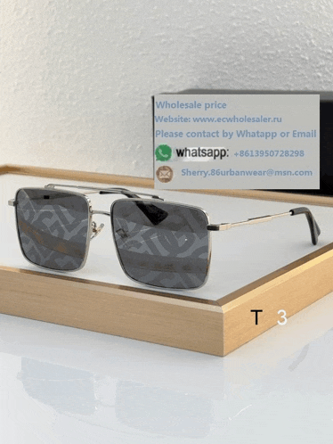 a pair of sunglasses sitting on a wooden tray with the number t3 on the bottom