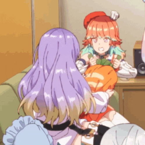 two anime girls are sitting on a couch and one has a pumpkin in her hand