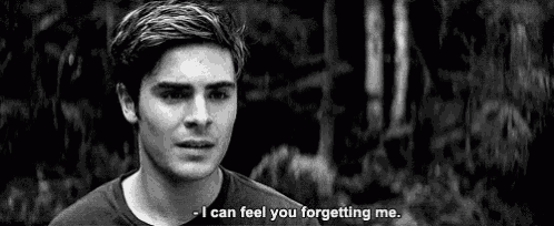 a man is talking to another man in a black and white photo and says `` i can feel you forgetting me . ''