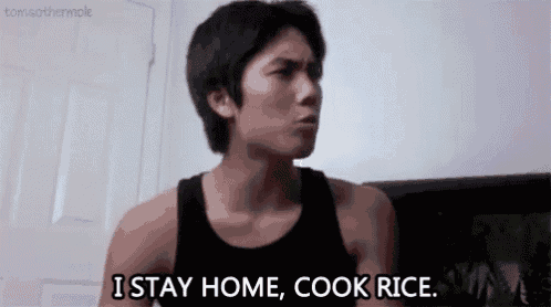 a man in a black tank top is saying `` i stay home , cook rice . ''