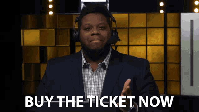 a man in a suit and headphones says " buy the ticket now "