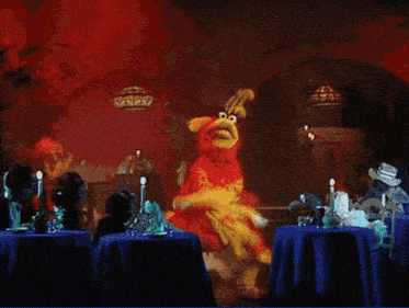 a cartoon character sitting at a table with a blue tablecloth