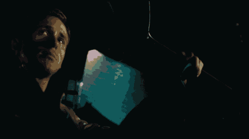 a man in a car with the word drive written on the screen