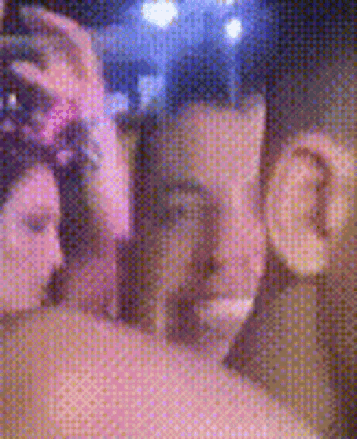 a man and a woman are taking a selfie with a camera .