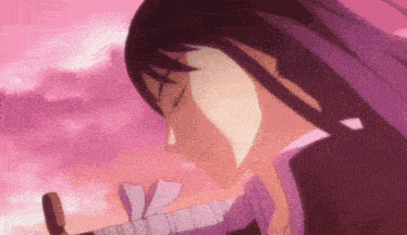 a close up of a person 's face with purple hair