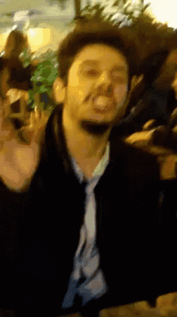 a blurry picture of a man making a face