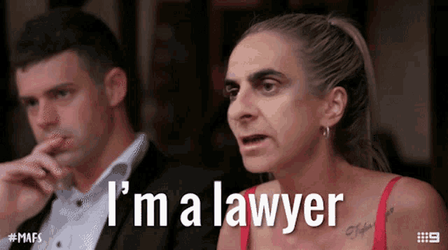 a woman in a red bra says i 'm a lawyer in front of a man in a suit
