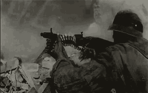 a black and white photo of a soldier with a gun