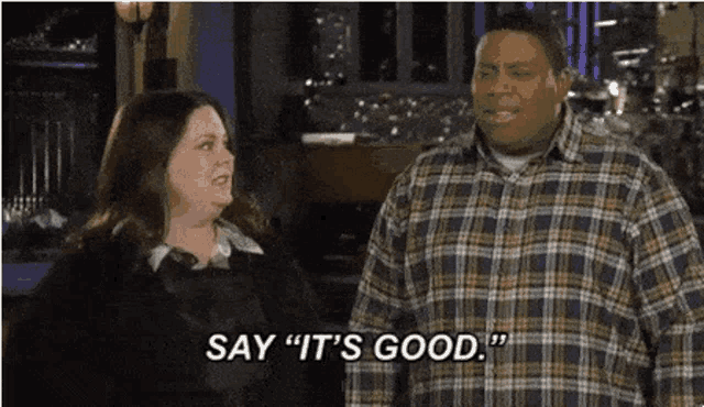 a man and a woman are standing next to each other and the man says it 's good .