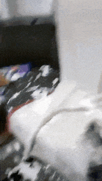 a person is laying on a bed with a blanket and a pillow