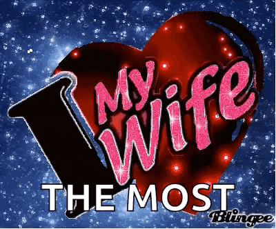 a red heart with the words " my wife the most " written on it
