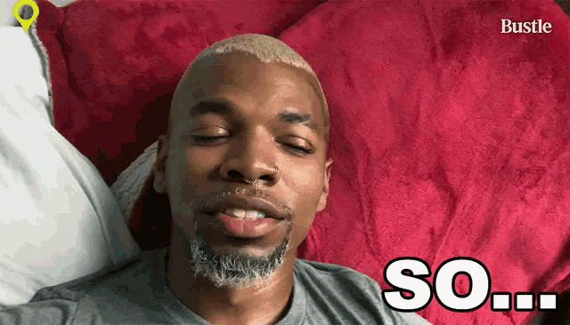 a man is laying on a bed with his eyes closed and the word so written on the bottom