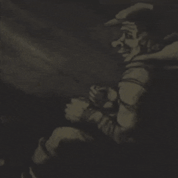 a man is playing a guitar in a dark room