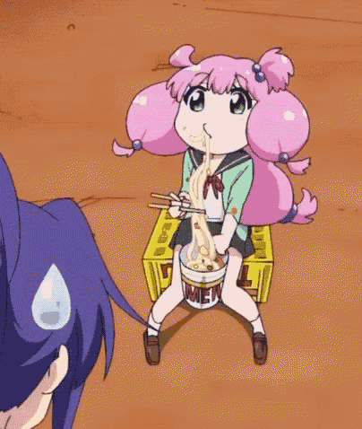 a girl with pink hair is eating ramen noodles with chopsticks .