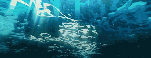 the sun shines through the water and shines through the waves