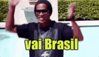 a man wearing sunglasses and a hat is standing in front of a pool with his arms in the air and the words vai brasil above him