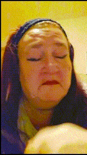 a woman with red hair is making a funny face