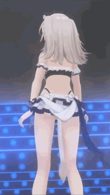 a girl in a maid outfit is standing on a stage in front of blue lights .