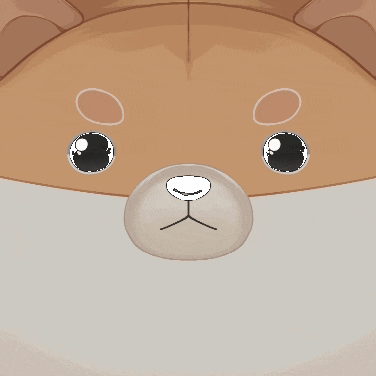 a close up of a stuffed animal 's face with circles around its eyes