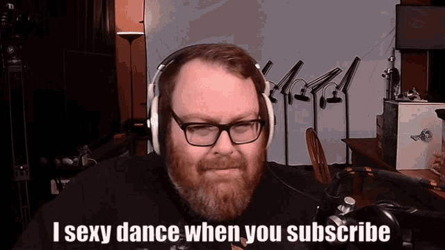 a man with a beard wearing headphones and glasses says i sexy dance when you subscribe