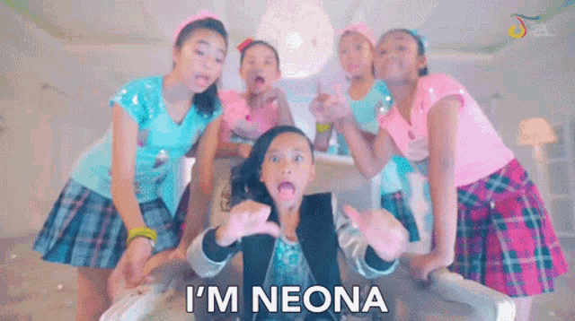 a group of girls are standing around a girl who says i 'm neona