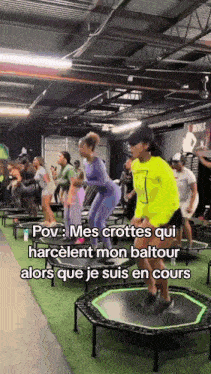 a group of people are jumping on trampolines in a gym with the caption pov mes crottes qui harcelent mon baltour