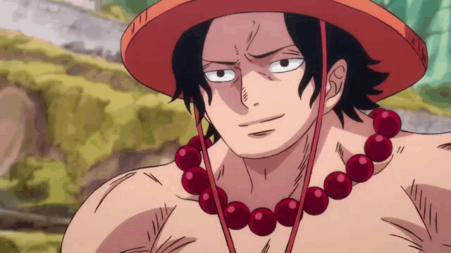 a man with a hat and a necklace of red beads