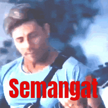 a blurry picture of a man with the word semangat in red letters