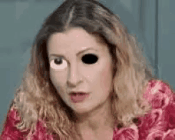 a close up of a woman 's face with a cartoon eye .