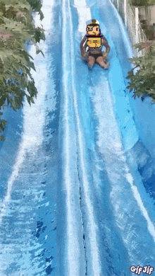 a person is sliding down a water slide with a gif gif written on the bottom