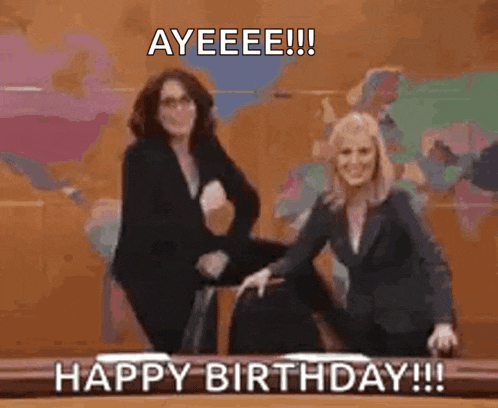 two women are dancing in front of a map of the world with the words happy birthday written on the bottom .