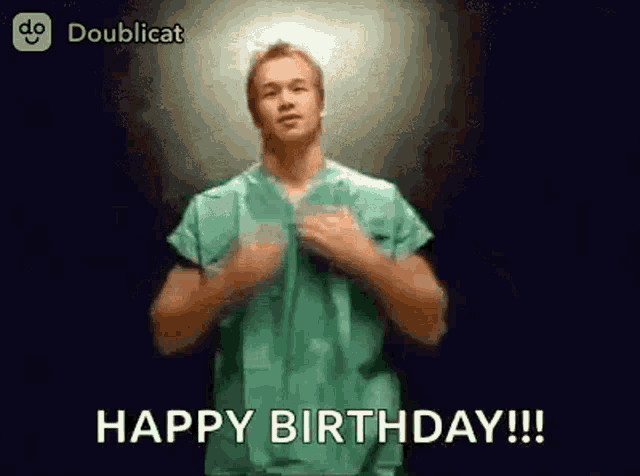 a man in a green scrub top is dancing and saying happy birthday .