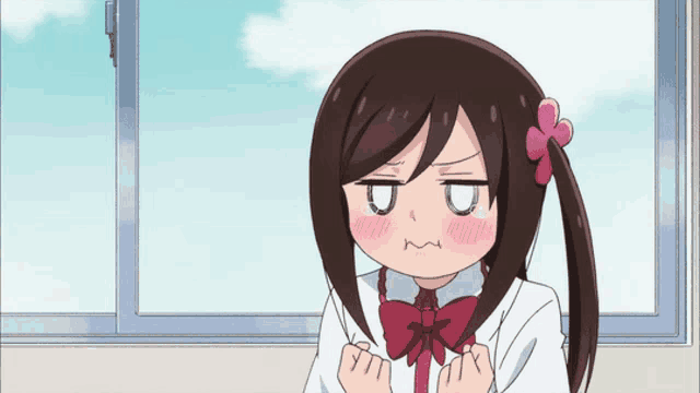 a cartoon girl with a flower in her hair is making a funny face
