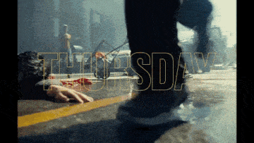the word thursday is on the side of a street