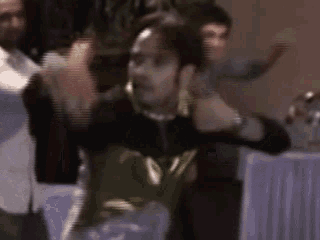 a blurry picture of a man dancing in a room