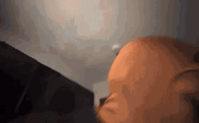 a close up of a person 's face with a blurred background .