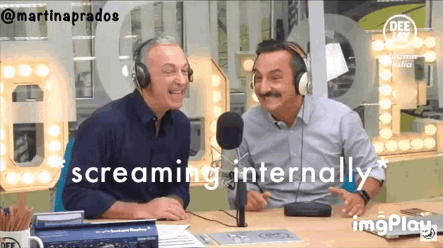 two men are sitting in front of a microphone with the words screaming internally below them