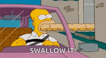 homer simpson is driving a car with a sandwich in his mouth and says `` swallow it ! ''