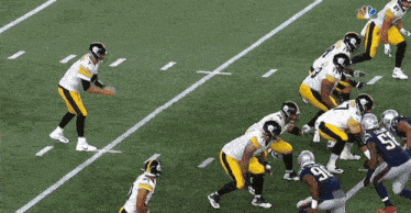 a football game is being played on a field with a nbc logo in the corner