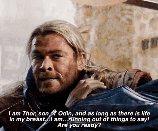a man with a beard and long hair is talking about thor 's breast